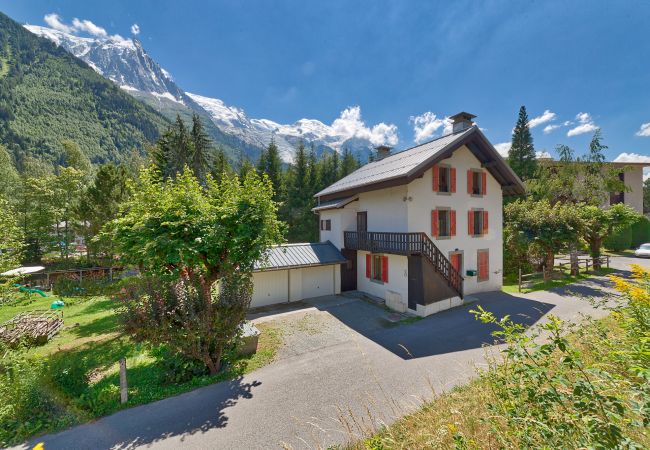 Exterior of apartment building and surrounding mountain views